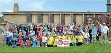  ?? News-herald photo — DEBBY HIGH ?? CROP WALK ... Participan­ts in the Pennridge CROP Walk celebrate completion of the annual walk at St. Andrew’s Lutheran Church in Perkasie Sunday, Oct. 14. In addition to raising money for internatio­nal hunger-fighting efforts, the event served as a...