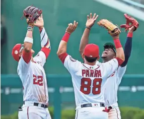  ?? SCOTT TAETSCH, USA TODAY SPORTS ?? Outfielders Juan Soto, left, Gerardo Parra and Victor Robles celebrate a win.