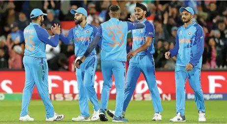  ?? (AFP) ?? India players celebrate after their victory against Bangladesh in their Twenty20 World Cup match in Adelaide on Wednesday