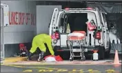  ?? Nardus Engelbrech­t Associated Press ?? A PARAMEDIC sanitizes an ambulance Friday at a private hospital in Cape Town, South Africa.