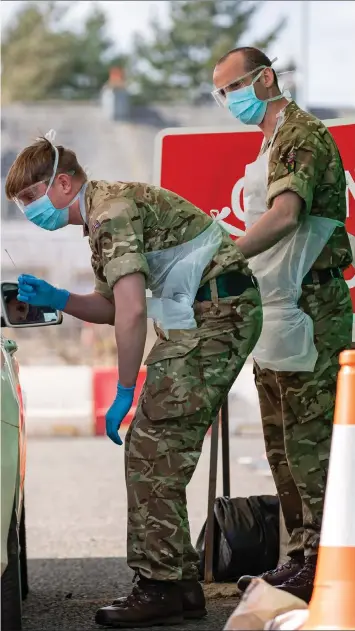  ??  ?? assist with the testing of NHS workers for Covid-19 in the new facility set up in Glasgow Airport car park