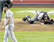  ?? MARK J. TERRILL/ASSOCIATED PRESS ?? Catcher Buster Posey reacts after San Francisco pitcher Matt Moore, left, lost his no-hit bid Thursday night with two out in the ninth inning.