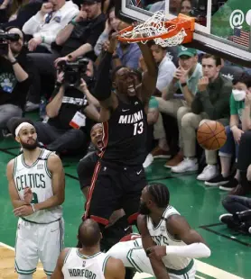  ?? Winslow Townson, Getty Images ?? Bam Adebayo of the Heat dunks the ball in the fourth quarter against the Celtics in Game 3.
