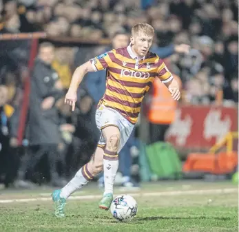  ?? ?? MAKING HIS POINT: Brad Halliday marked his 100th appearance for Bradford City with an unstoppabl­e shot that earned them victory over Gillingham.