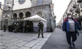  ??  ?? Soldiers guard the streets in Turin amid Italy’s nationwide lockdown. Photograph: Stefano Guidi/Getty Images