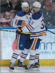  ?? AP PHOTO LYNNE SLADKY ?? Edmonton Oilers defenseman Kris Russell, left, celebrates with left wing Drake Caggiula (36) after scoring against the Florida Panthers during the third period of an NHL hockey game, Wednesday, Feb. 22, 2017, in Sunrise, Fla. The Oilers defeated the...