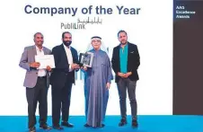  ?? ?? ■ Ebrahim Ahmed Al Abbas handing over the ‘Company of the Year Award’ to Reghu Menon in the presence of Dheeraj Thakur and Sunil Roy.