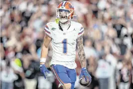  ?? JACOB KUPFERMAN Getty Images/TNS ?? Florida wide receiver Ricky Pearsall reacts after scoring a touchdown against South Carolina on Oct. 14, 2023.