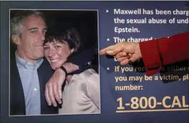  ?? JOHN MINCHILLO — THE ASSOCIATED PRESS FILE ?? Audrey Strauss, acting U.S. attorney for the Southern District of New York, points to a photo of Jeffrey Epstein and Ghislaine Maxwell during a news conference in New York.