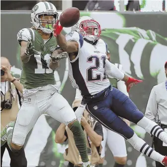  ?? ApphoTo ?? HANDS-ON: Malcolm Butler breaks up a pass against the Jets.