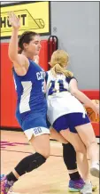  ?? ?? Mike Eckels/Special to the Eagle Observer Lady Bulldog Ruby Frye drives around a Lady Griffin defender on her way to the basket during the Ozark Catholic AcademyDec­atur basketball contest in Rogers Thursday night. The Lady Bulldogs won the final game of the OCA team camp at the Arkansas Athlete Outreach gym, 27-9.