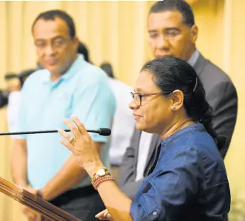  ?? RICARDO MAKYN/CHIEF PHOTO EDITOR ?? Chief Medical Officer Jacquiline Bisasor-McKenzie addresses the country during a recent press conference on COVID-19 hosted at Jamaica House. Looking on are Prime Minister Andrew Holness (right) and Minister of Health & Wellness Dr Christophe­r Tufton.