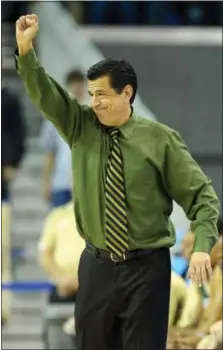  ?? MARK J. TERRILL — THE ASSOCIATED PRESS FILE ?? In this file photo, Sacramento State head coach Brian Katz gestures against UCLA. While coaches at schools like Duke, Kansas and Arizona had their eyes set on the elite, five-star players during the high school showcases, coaches at other low-major...
