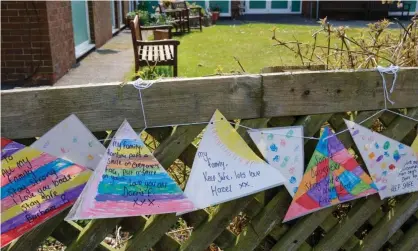  ?? Photograph: Robin Weaver/Alamy Stock Photo ?? Messages to loved ones tied to the fence outside a nursing home during the Coronaviru­s lockdown, Ashbourne, Derbyshire.