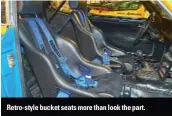  ??  ?? Retro-style bucket seats more than look the part.