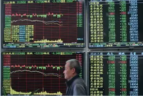  ?? (China Daily/Reuters) ?? AN ELECTRONIC BOARD shows stock informatio­n last month at a brokerage house in Jiujiang, in the Jiangxi province of China.