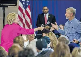  ?? Brendan Hoffman Getty Images ?? “I WANT TO BUILD on what we’ve already achieved,” Hillary Clinton said in Clinton, Iowa, emphasizin­g progress on healthcare under President Obama.