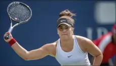  ?? FRANK GUNN - THE ASSOCIATED PRESS ?? Bianca Andreescu, of Canada, lunges for a forehand on her way to defeating Karolina Pliskova, of the Czech Republic, during quarterfin­al play at the Rogers Cup tennis tournament Friday, Aug. 9, 2019, in Toronto.