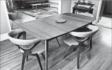  ?? SOLVEJ SCHOU/AP ?? This dining room table and chairs in a Pasadena, Calif., home are inspired by midcentury modern design.