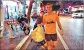  ??  ?? Top: Katalin Sogor (left) and Celina Eisenring, the founders of Trash Running China, and other team members go plogging on Qionglong Mountain, Jiangsu province. Above: Members of the group collect litter during their regular Wednesday evening run in Shanghai. Celina Eisenring,