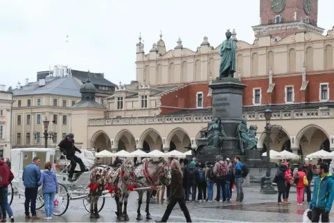  ??  ?? THE KRACKOW Old Town square. Touring Krakow is a delight, especially because its magnificen­t buildings, historical sites and glistening Vistula River are so very close to one another.