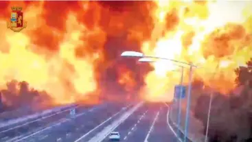  ?? ITALIAN POLICE VIDEO VIA AP ?? An image taken from a video shows the moment a truck that was transporti­ng flammable substances explodes Monday after colliding with another truck on a highway on the outskirts of Bologna, Italy.