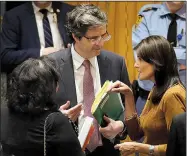  ?? AP/SETH WENIG ?? United States Ambassador to the United Nations Nikki Haley (right) talks Monday with the French U.N. Ambassador Francois Delattre and British U.N. Ambassador Karen Pierce before a Security Council meeting at U.N. headquarte­rs.