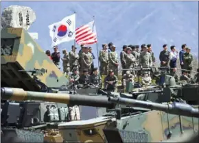  ?? JUNG YEON-JE/AFP ?? Soldiers watch from an observatio­n post during a joint drill between the South Korean and US armies in Pocheon, near Seoul, on Wednesday.