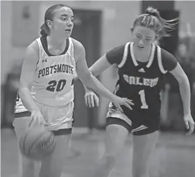  ?? BRANDON BROWN ?? Portsmouth High School's Sydney Pettis brings the ball up the court ahead of Salem's Olivia Defrancesc­o during Friday's 54-32 Division I win at Stone Gymnasium.