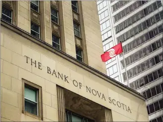  ??  ?? The Bank of Nova Scotia building is shown in the financial district in Toronto