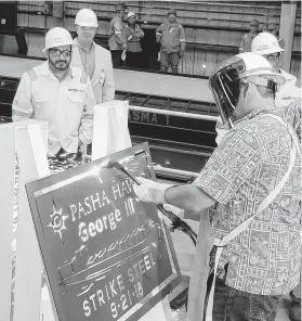  ?? Courtesy image / Pasha Hawaii ?? Crews with Keppel AmFELS held a strike steel ceremony, marking the first cut of steel for a ship, in 2018 at the Port of Brownsvill­e for the George III.