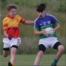  ??  ?? Cillian Ferriter of Glynn-Barntown tries to escape the close attention of Shay O’Leary (Sarsfields).