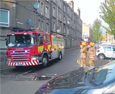  ??  ?? A DUNDEE street was closed off after a slate on a roof became dislodged.
Two fire crews were called to Baldovan Terrace yesterday to deal with the incident.
The Scottish and Fire Rescue Service was able to secure the slate after a call had been...