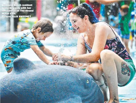  ??  ?? Bushland Beach resident Jamie Edwards with her son Lane, 3, at The Strand Water Park.
Picture: ALIX SWEENEY