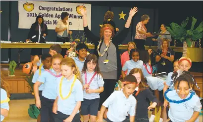  ?? STAFF PHOTO BY JAMIE ANFENSON-COMEAU ?? Tricia Morrison, a first-grade teacher at St. Mary’s School in Bryantown, was named a 2016 Golden Apple Award recipient by the Archdioces­e of Washington.