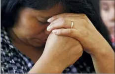  ?? ROGELIO V. SOLIS — THE ASSOCIATED PRESS ?? A woman prays during a Spanish Mass at Sacred Heart Catholic Church in Canton, Miss., Sunday. Churches have been key to providing spiritual and emotional comfort to workers following immigratio­n raids at seven Mississipp­i poultry plants, and are now stepping up to provide material aid to jailed or out-of-work church members, even as some church leaders denounce the raids that Republican leaders of the conservati­ve state have applauded.