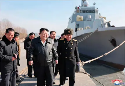  ?? AFP PHOTO ?? North Korean leader Kim Jong Un (center) inspects the Nampho Dockyard in North Korea on Friday, Feb. 2, 2024.