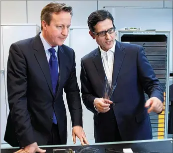  ??  ?? Drawing a line: Indro Mukerjee, as chairman of FlexEnable, meets David Cameron in Cambridge,