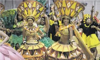  ?? Picture: AFP ?? Performers from Cape Town Carnival take part in the annual Lunar New Year parade marking the Year of the Pig in the Kowloon district of Hong Kong on Tuesday.