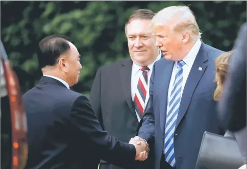  ??  ?? Kim Yong Chol shakes hands with Trump as Secretary of State Mike Pompeo looks on after a meeting at the White House in Washington, US. — Reuters photo