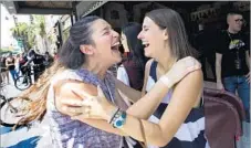  ??  ?? JESSICA WALL, left, celebrates with Pepperdine roommate Elizabeth Waters after winning “Hamilton” tickets in the lottery.