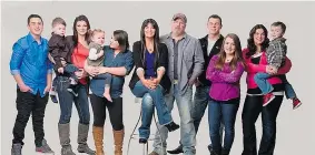  ?? CORUS ENTERTAINM­ENT INC/THE CANADIAN PRESS ?? Mom’s a Medium star Carmel Baird from Edmonton, centre, has a big family including six
children and grandchild­ren.