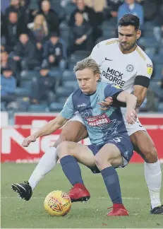  ??  ?? Posh centre-back Ryan Tafazolli battles for the ball at Wycombe.