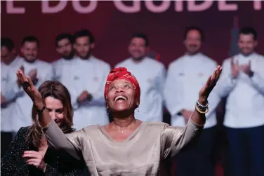  ?? Photo/Jean-Francois Badias) ?? Georgiana Viou celebrates her star during the 2023 Michelin Guide ceremony in Strasbourg, eastern France, Monday, March 6, 2023. The self-taught chef from the west African country Benin, whose dream was to go to France to become an interprete­r, was awarded a star on Monday by the Michelin Guide, the bible of gastronomy, for her cuisine at a restaurant in Nimes, southern France. (AP