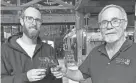  ?? MAX SULLIVAN/SEACOASTON­LINE ?? David Woods II, left, and his father David Woods are the owners of Wiggly Bridge Distillery on Route 1 in York, Maine.