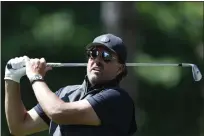  ?? ?? Phil Mickelson watches his shot during the Pro-Am at the Centurion Club in Hertfordsh­ire, England, on Wednesday.