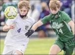  ??  ?? CBA’S Jordan Proulx (4) fights for position with Shen’s Gavin Harrington. Proulx scored his 11th goal of the season early in the second half.