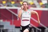  ?? Martin Meissner / Associated Press ?? On Friday, Krystsina Tsimanousk­aya, of Belarus, runs in the women's 100-meter run at the 2020 Summer Olympics in Tokyo.