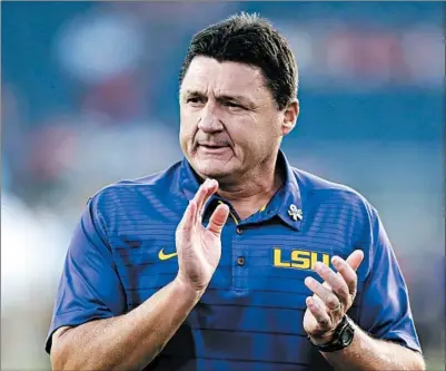  ?? ROGELIO V. SOLIS/AP ?? LSU football coach Ed Orgeron says he sees the “light at the end of the tunnel” with players set to return to campus as early as June 1.