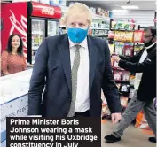  ??  ?? Prime Minister Boris Johnson wearing a mask while visiting his Uxbridge constituen­cy in July